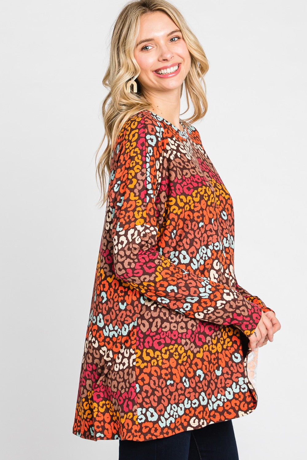 Women's multi-color leopard print long sleeve top by Cream N Sugar, loose fit, stylish animal print blouse with a relaxed silhouette.