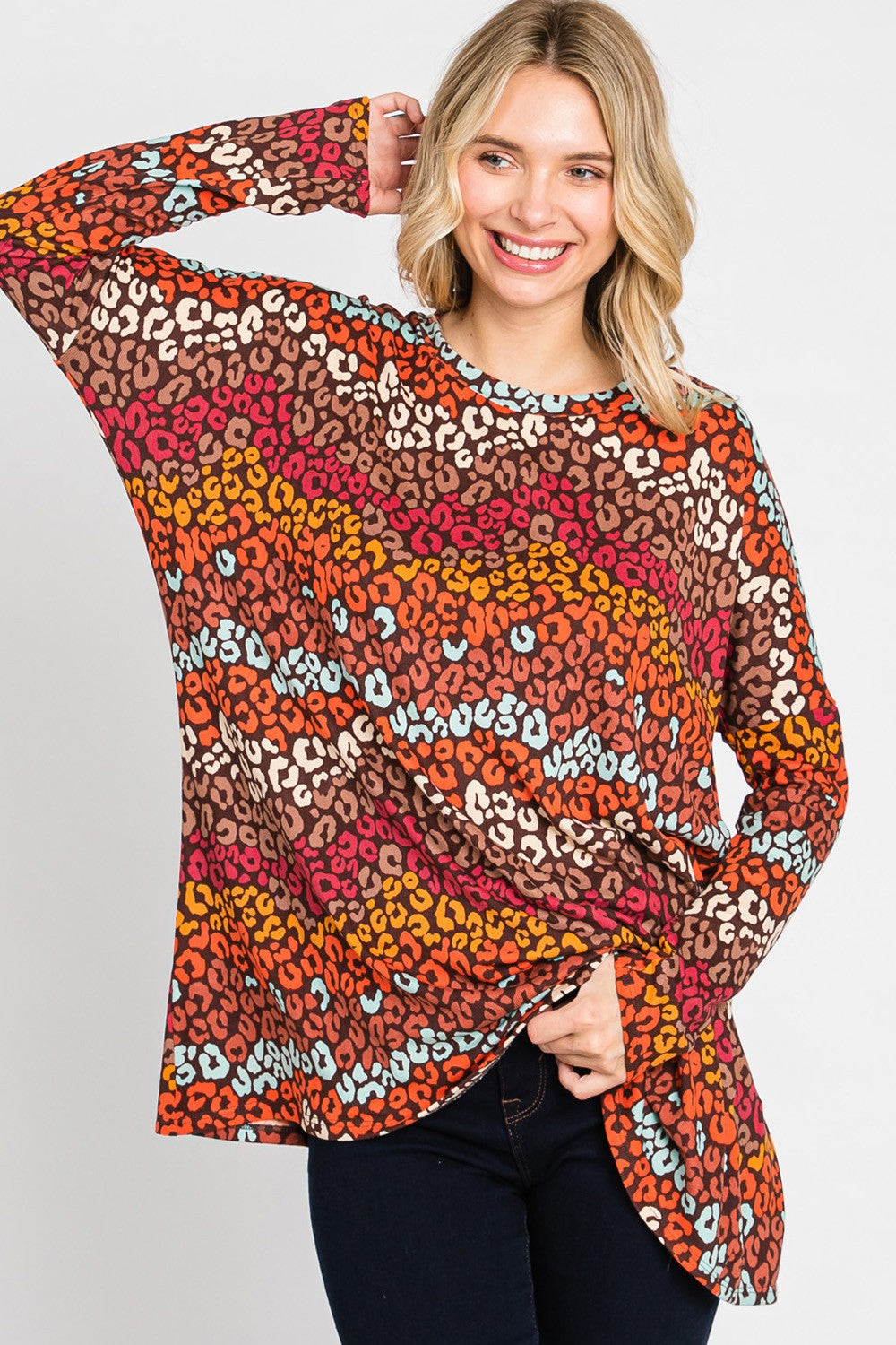 Women's long sleeve loose-fit top with multicolor leopard print by Cream N Sugar, featuring a stylish animal print design.