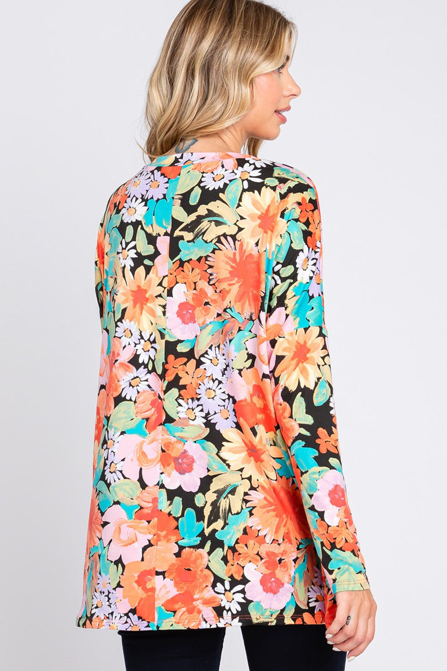 Cream N Sugar floral print long sleeve loose fit top with a relaxed style, featuring a colorful floral pattern.