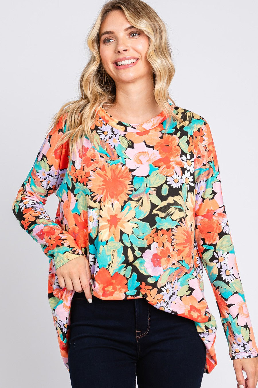 Cream N Sugar floral print long sleeve loose fit top with a relaxed silhouette and feminine design.