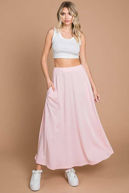 Black Culture Code maxi full solid skirt with pockets, featuring a comfortable, flowing design and stylish details.