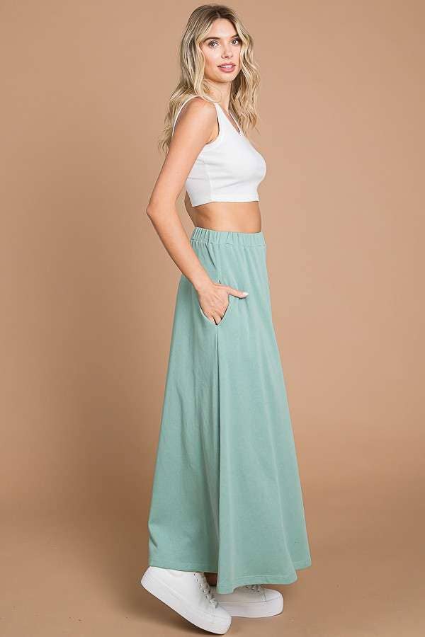 Black Culture Code maxi skirt with a full-length solid design and convenient pockets, perfect for casual or dressy wear.