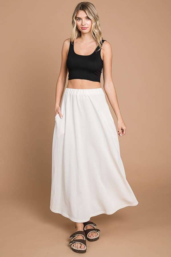 Black Culture Code maxi skirt with a full solid design and practical pockets, perfect for casual or dressy occasions.