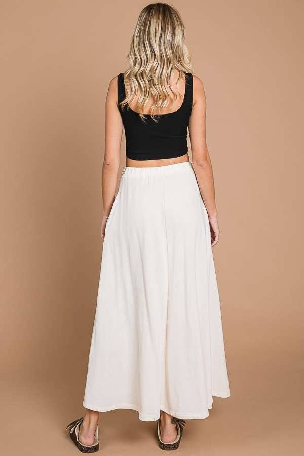 Black Culture Code maxi skirt with full solid design and practical pockets, perfect for casual or stylish everyday wear.