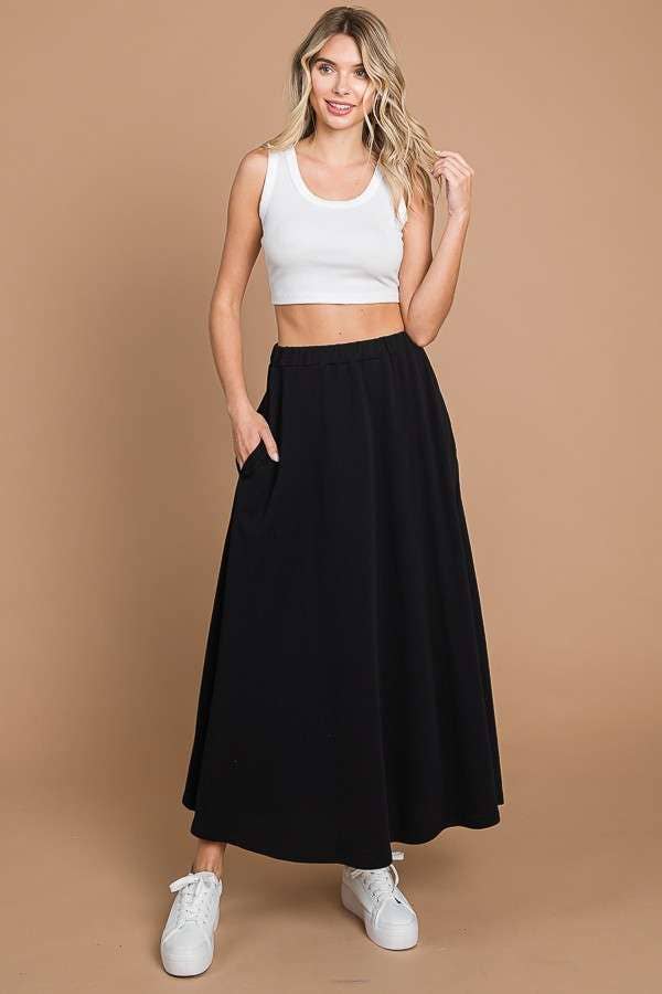 Culture Code black maxi skirt with full solid design and practical pockets, featuring a comfortable, flowing fit.