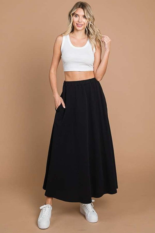 Culture Code black maxi skirt with pockets, full solid design, stylish and comfortable for casual or dressy occasions.