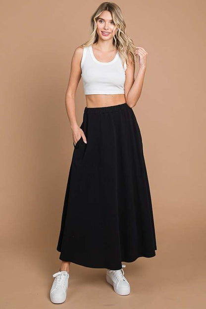 Culture Code black maxi skirt with pockets, full solid design, stylish and comfortable for casual or dressy occasions.
