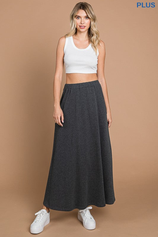 Black culture code maxi skirt with pockets, full-length solid design, comfortable and stylish for casual wear.