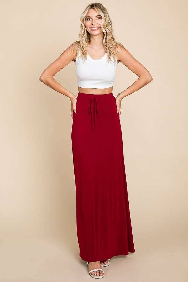 Cream draw string flare maxi skirt by Culture Code, featuring a flowy silhouette and relaxed fit with side pockets.
