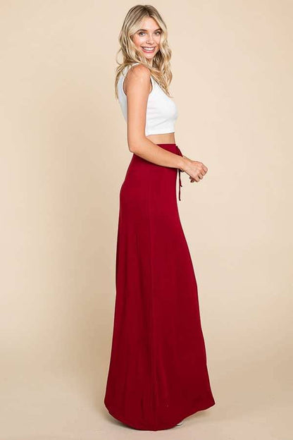 Culture Code ecru draw string flare maxi skirt with a flowing silhouette and elastic waistband, perfect for casual and summer wear.