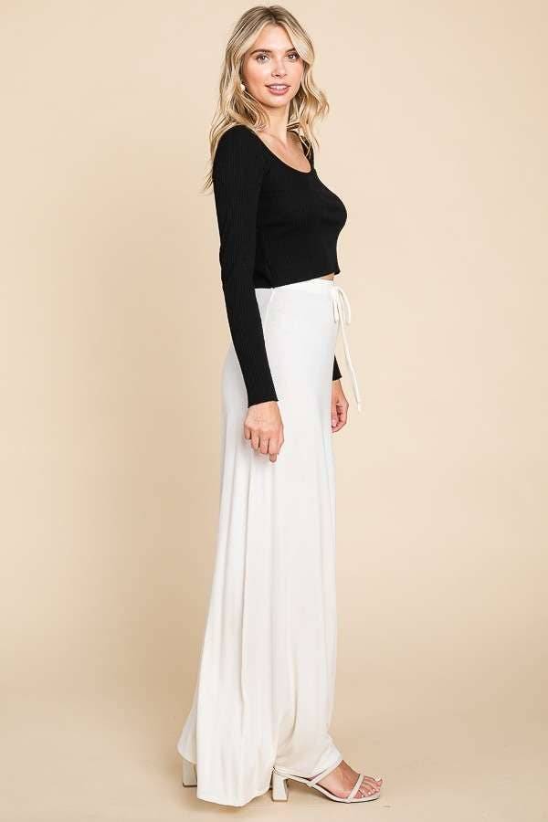 Culture Code ecru draw string flare maxi skirt featuring a flowy silhouette and ankle-length design.