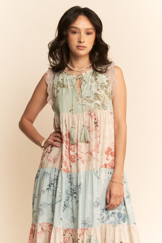 Plus-size floral tiered block print sleeveless maxi dress by Davi&Dani, featuring vibrant floral patterns and flowing fabric.