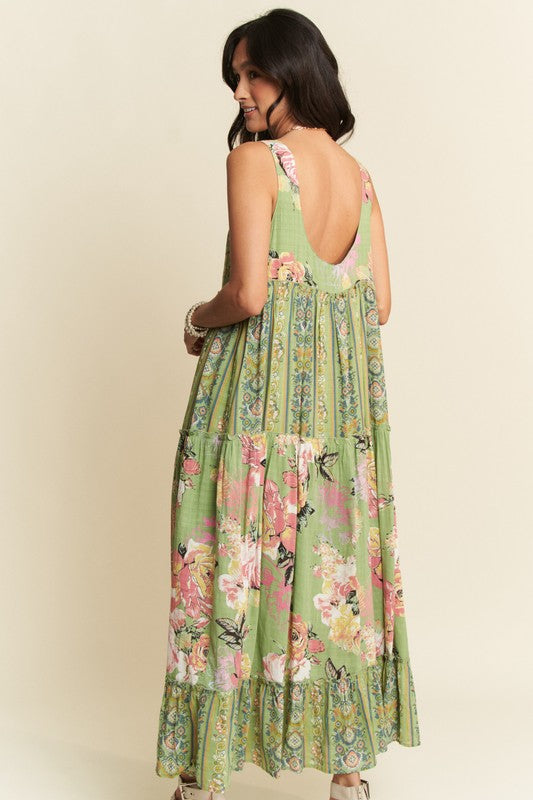Gorgeous mixed print boho maxi dress from Davi & Dani, featuring flowing fabric and vibrant patterns for a stylish summer look.