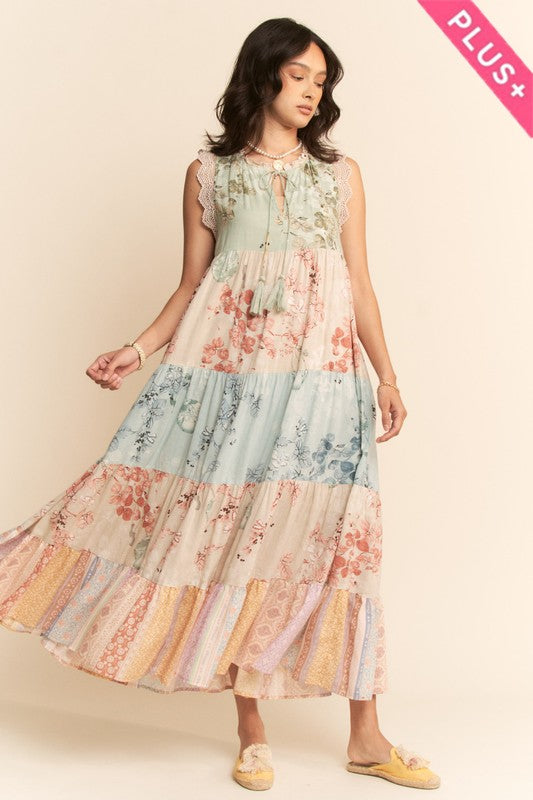 Plus floral tiered sleeveless maxi dress by Davi&Dani featuring vibrant block print and flowing silhouette.