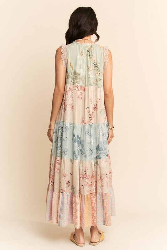 Davi&Dani plus floral tiered sleeveless maxi dress with block print, featuring a flowing silhouette and vibrant floral patterns.