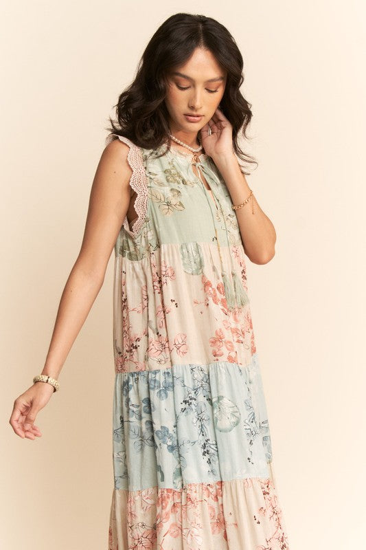 Plus size floral tiered block print sleeveless maxi dress by Davi&Dani, featuring a flowing silhouette and vibrant floral pattern.