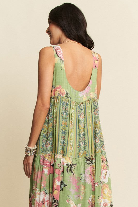 Gorgeous mixed print boho maxi dress by Davi & Dani with flowing fabric and vibrant patterns for boho style.