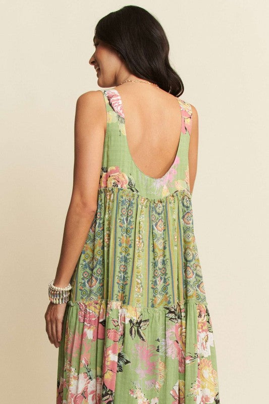Gorgeous mixed print boho maxi dress by Davi & Dani, flowing fabric with vibrant patterns, sleeveless design, perfect for summer wear.