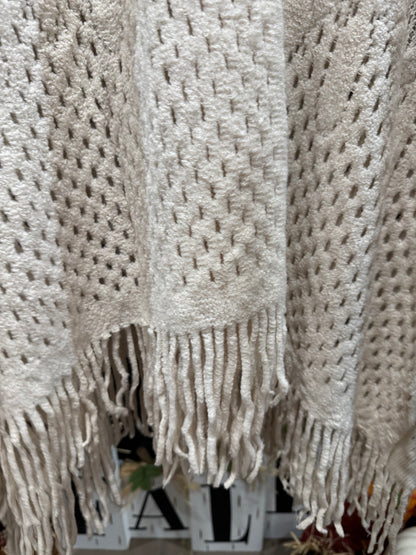 Ivory poncho fringe detail