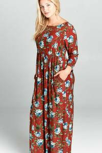 Emerald plus size 3/4 sleeve floral maxi dress with vibrant print and flowing fabric, perfect for casual or semi-formal occasions.