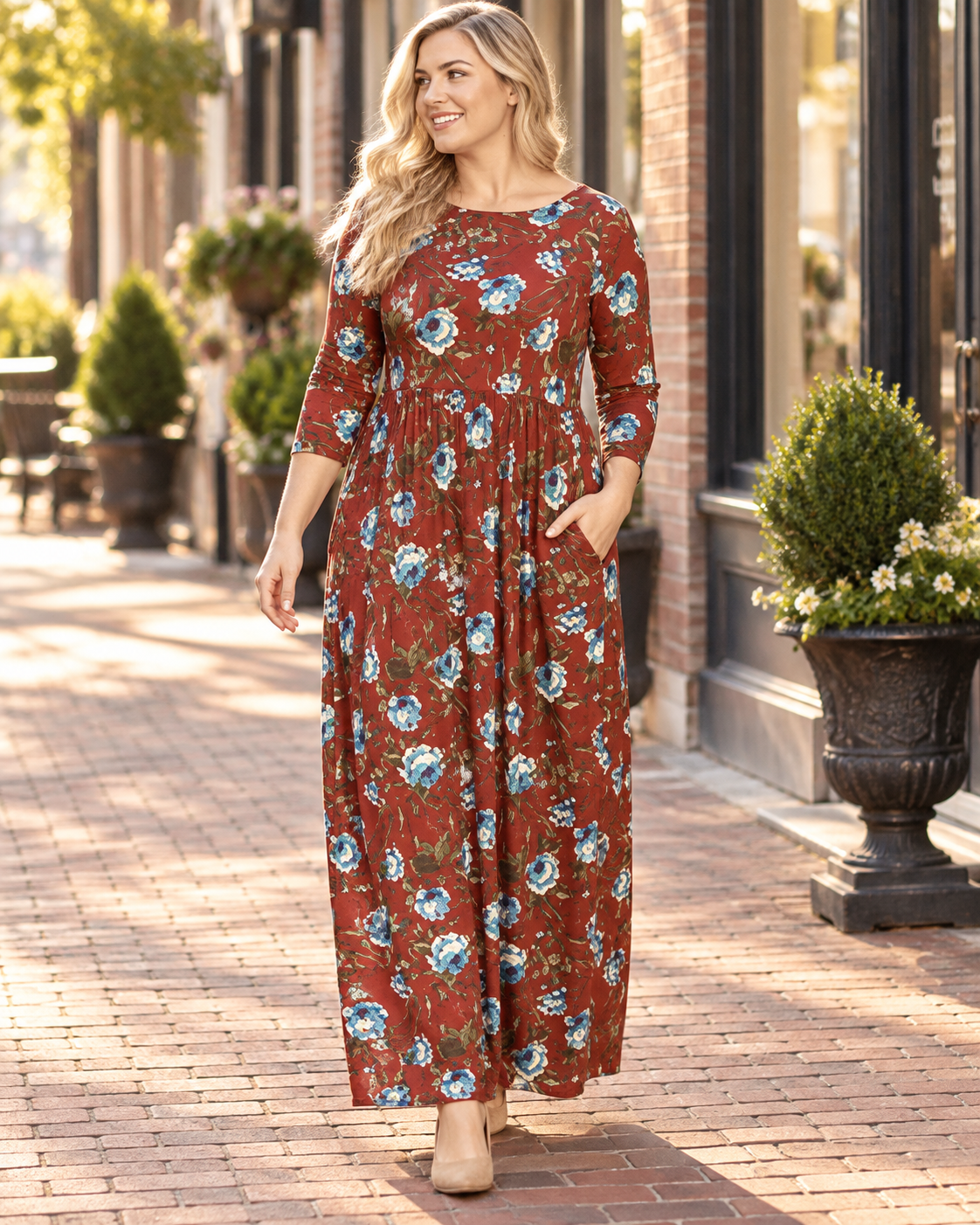 Emerald plus size floral maxi dress with 3/4 sleeves in rust and teal, flowing design perfect for casual or dressy occasions.