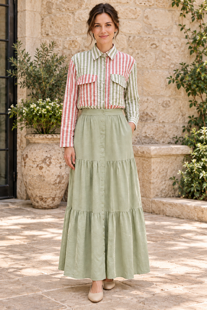 Woman wearing Fantastic Fawn mauve and sage striped long-sleeve shirt with Timing sage green tiered maxi skirt, front view