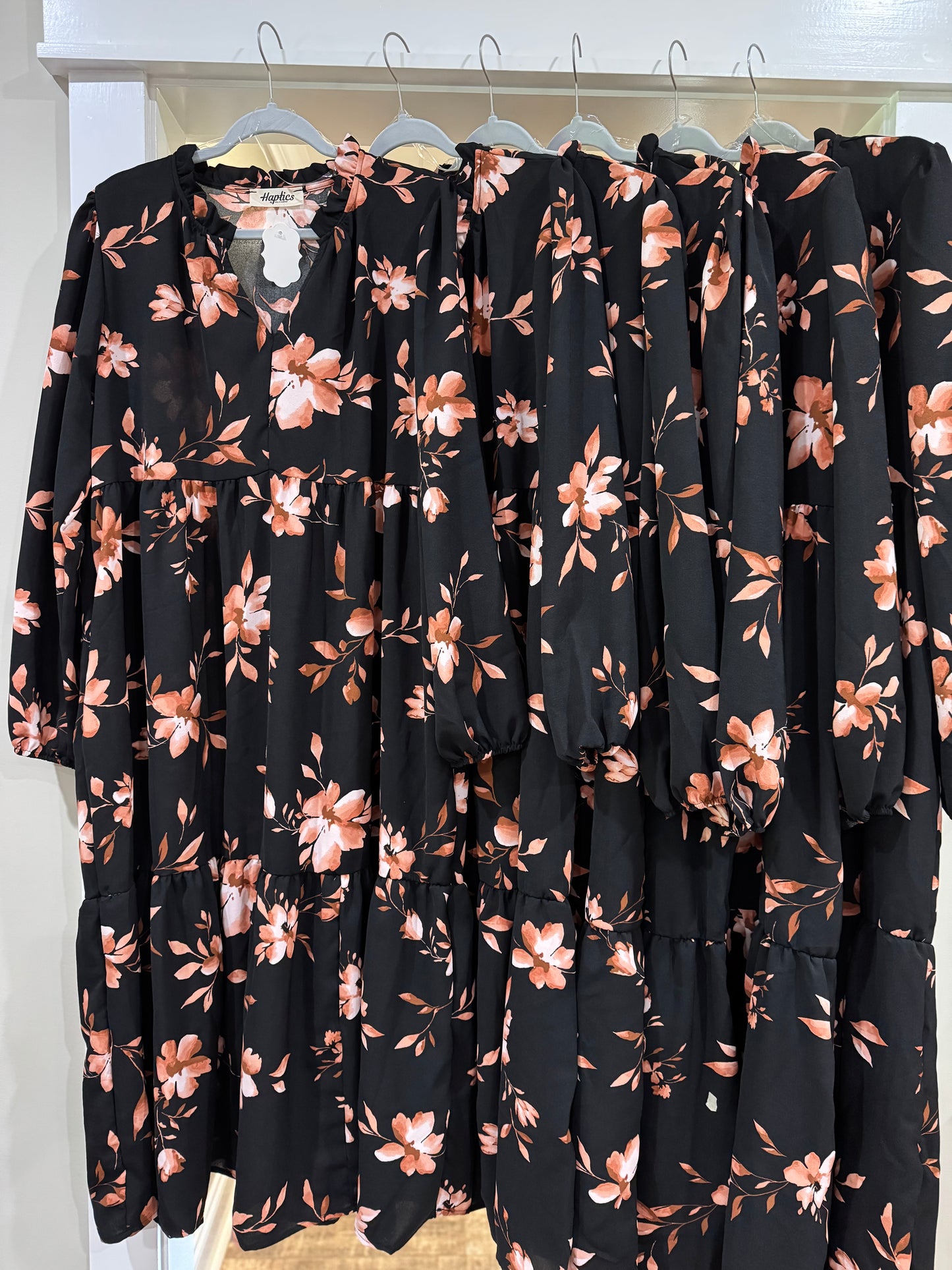 Plus size Gilli floral print tiered dress with split neckline, featuring a feminine, flowy silhouette and vibrant floral pattern.