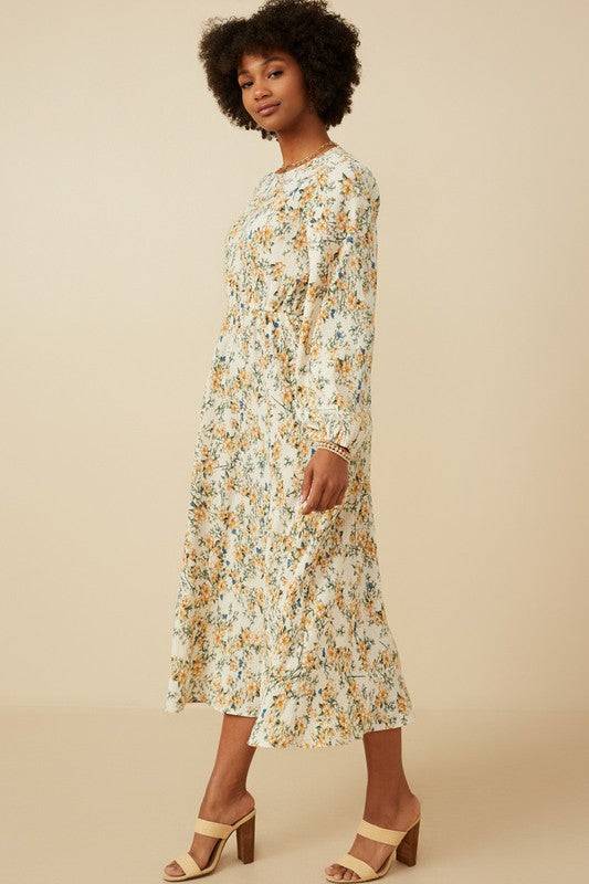 Botanical print puffed long sleeve dress by Hayden Los Angeles, featuring a flowing silhouette and vibrant floral pattern.