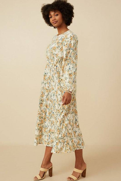 Botanical print puffed long sleeve dress by Hayden Los Angeles, featuring a flowing silhouette and vibrant floral pattern.