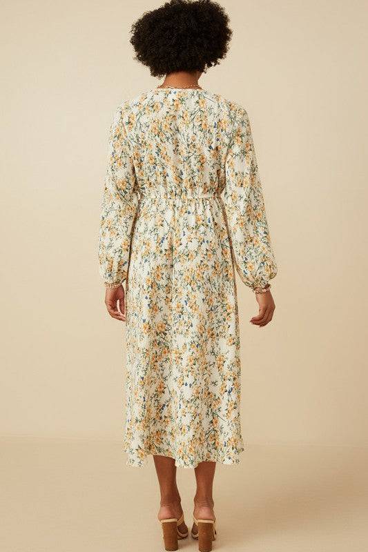 Botanical print puffed long sleeve dress by Hayden Los Angeles, featuring a flowy silhouette and vibrant floral pattern.