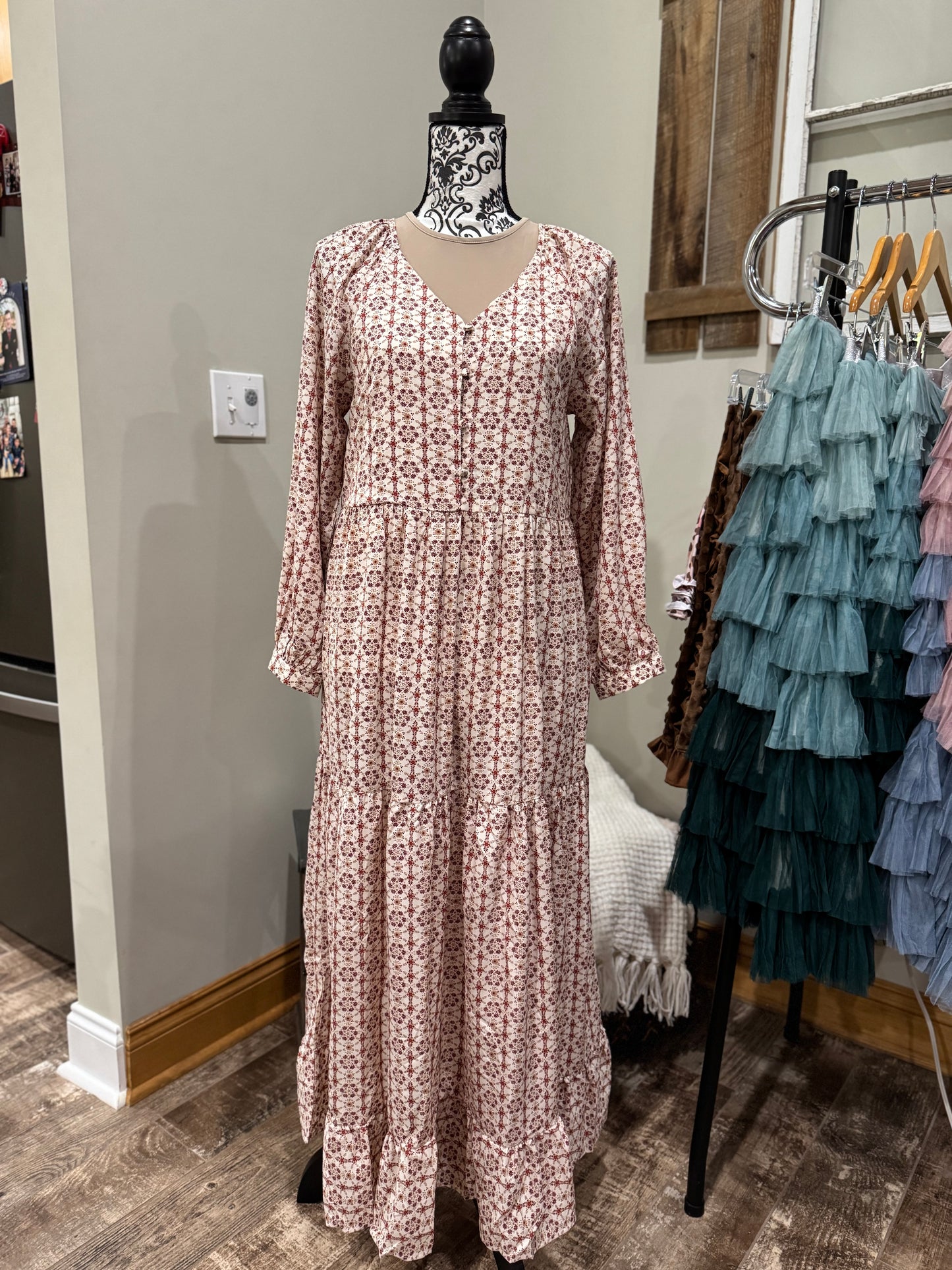 Long sleeve tiered button-front V-neck dress by Hayden Los Angeles, featuring a stylish and flowy design.