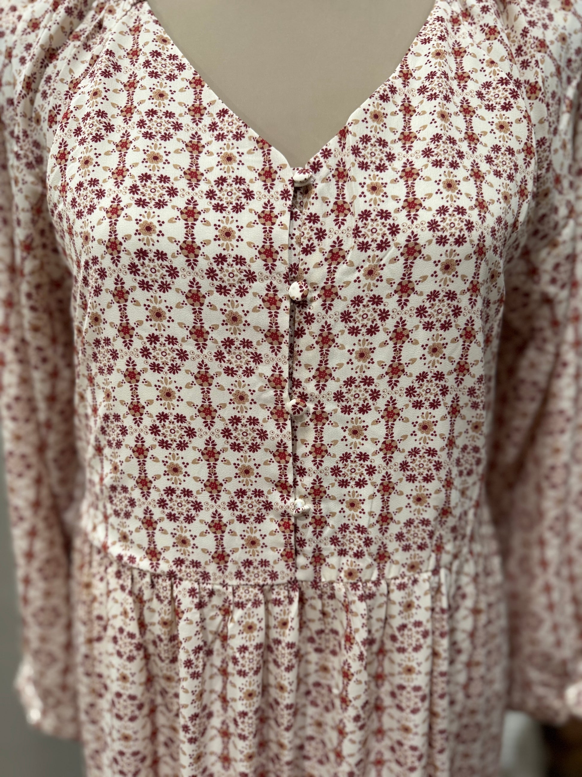 Long sleeve tiered button front V-neck dress by Hayden Los Angeles, featuring a flowing silhouette and stylish design.
