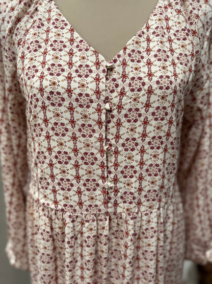 Long sleeve tiered button front V-neck dress by Hayden Los Angeles, featuring a flowing silhouette and stylish design.