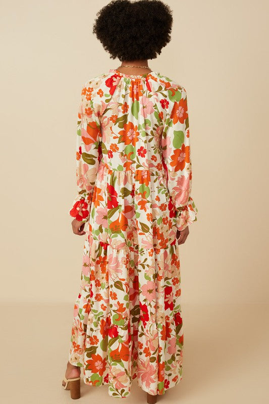 Women's satin floral tie neck tiered maxi dress by Hayden Los Angeles, featuring elegant floral print and flowing silhouette.