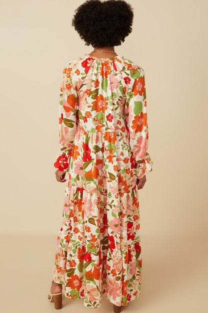 Women's satin floral tie neck tiered maxi dress by Hayden Los Angeles, featuring elegant floral print and flowing silhouette.