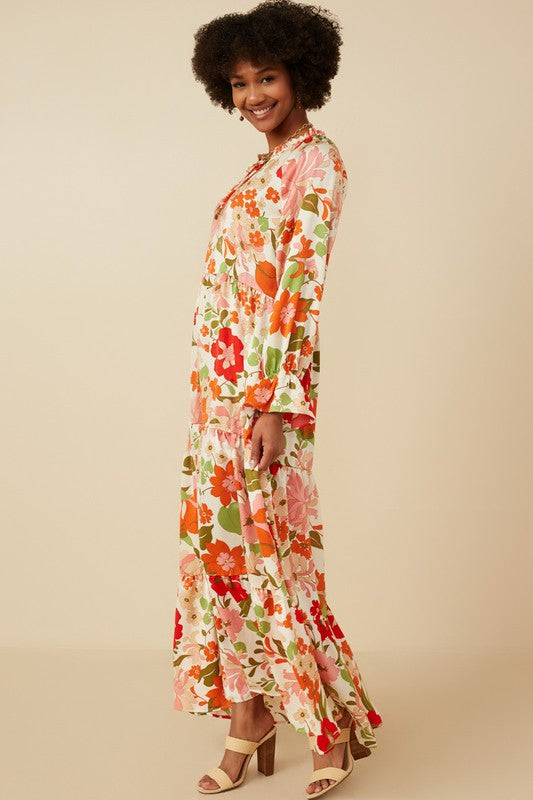 Women's satin floral tie neck tiered maxi dress by Hayden Los Angeles, featuring a flowing silhouette and elegant floral pattern.