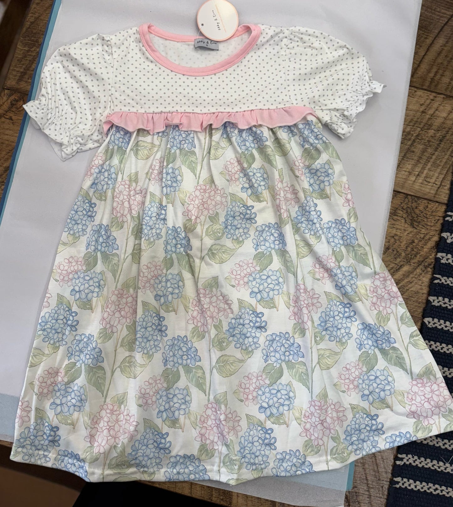 Assorted girls' summer dresses by HoneyDew featuring navy trims and blue floral patterns, suitable for 12-month-old girls.
