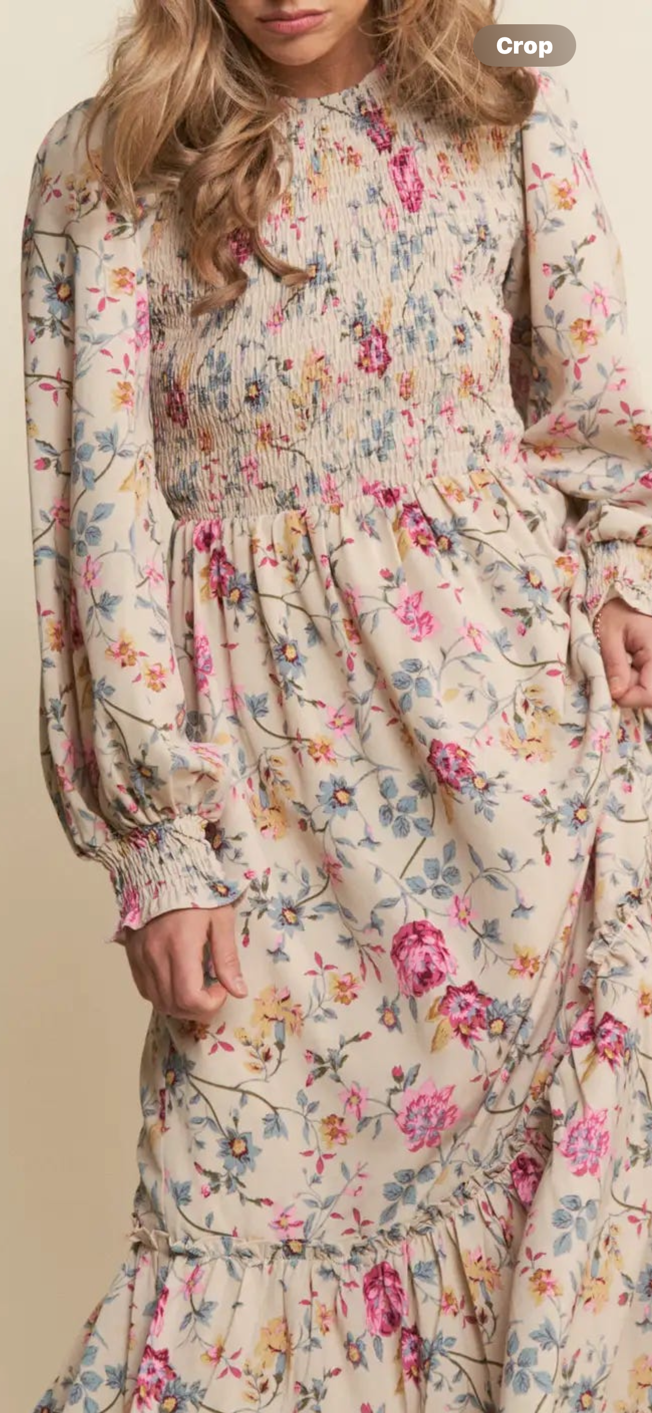 Floral print smocked tiered maxi dress by J.NNA featuring a flowy silhouette and vibrant floral pattern.