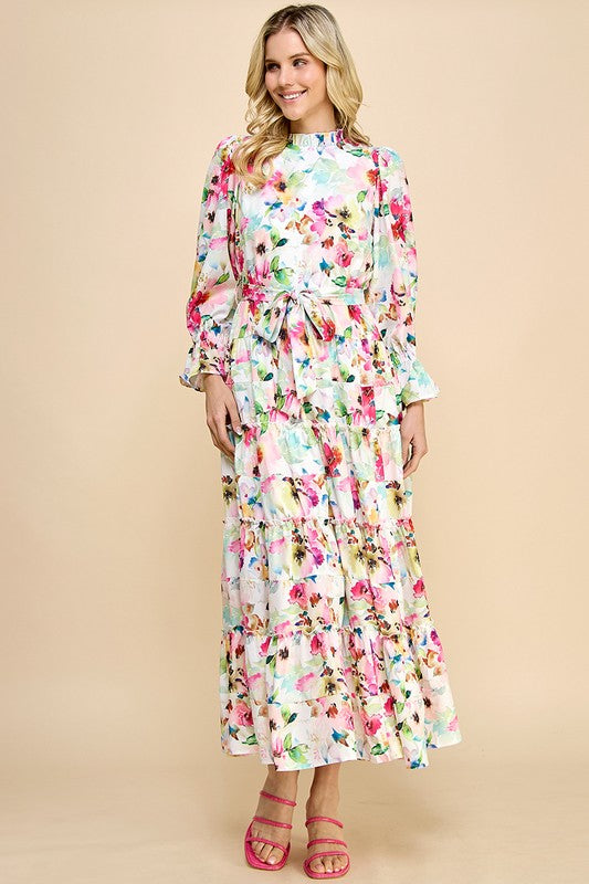 Long sleeve floral print maxi dress with ruffle accents by JJ's Fairyland, featuring a flowing silhouette and vibrant flower patterns.