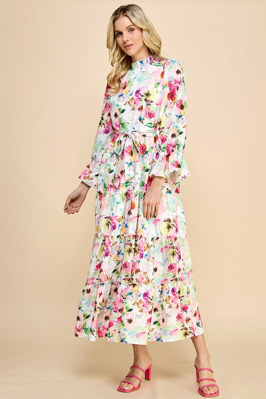 Long sleeve floral print maxi dress with ruffle accents by JJ's Fairyland, featuring a flowing design and vibrant floral pattern.