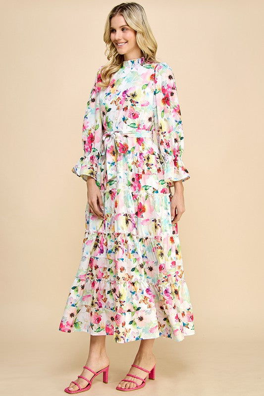 Long sleeve floral print maxi dress by JJ's Fairyland featuring ruffle accents and a flowing design for elegant style.