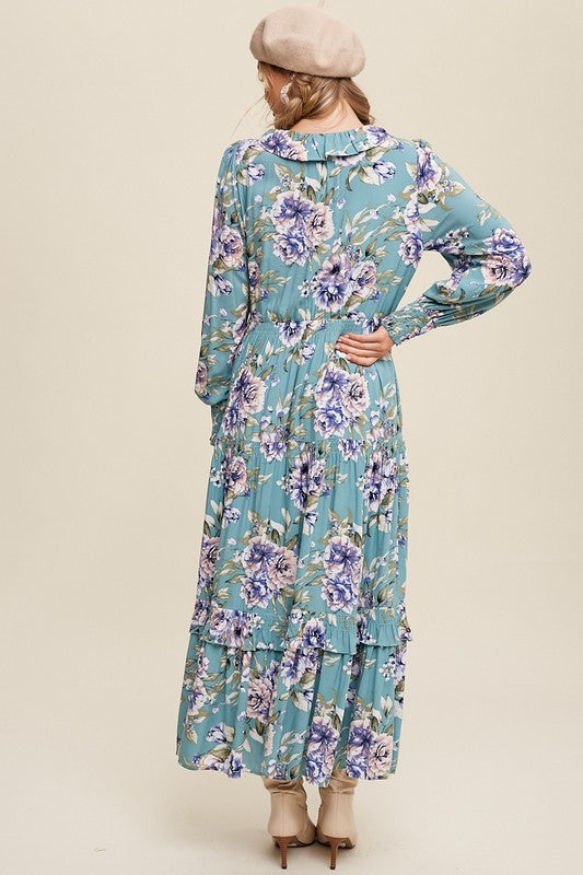 Listicle floral print maxi dress with tie front, sleeveless design, flowing fabric, and vibrant floral pattern.