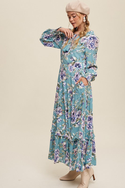 Tie front floral print maxi dress by Listicle, featuring a flowing design with vibrant floral patterns and a stylish tie detail.