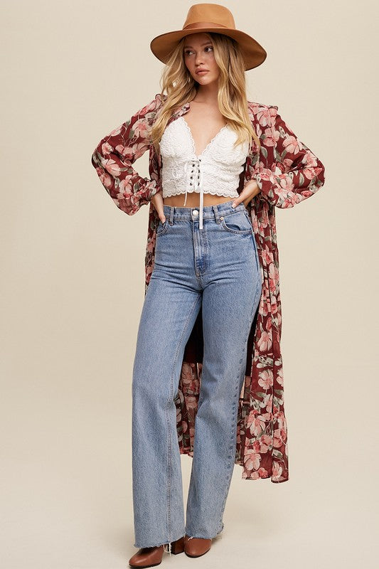 Floral flowy long sleeve button-down maxi dress by Listicle featuring a relaxed fit and vibrant floral pattern.