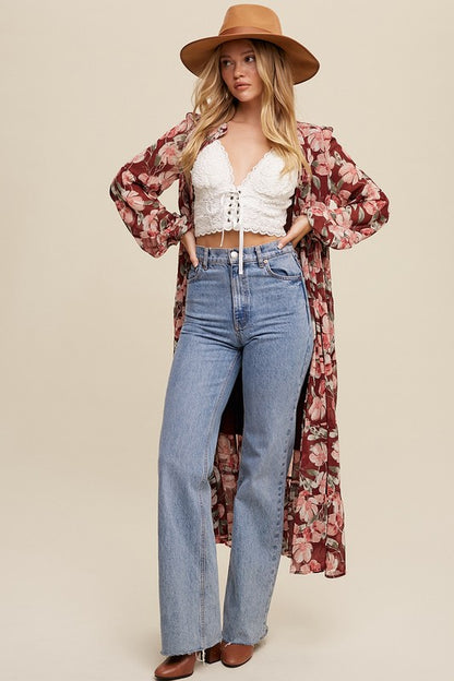 Floral flowy long sleeve button-down maxi dress by Listicle featuring a relaxed fit and vibrant floral pattern.