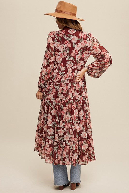 Floral flowy long sleeve button-down maxi dress by Listicle, featuring a vibrant floral pattern and a relaxed, elegant fit.