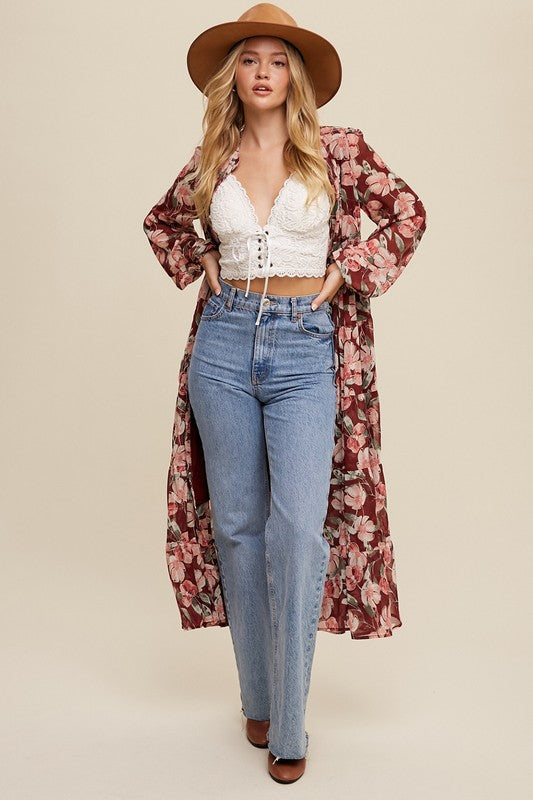 Floral flowy long sleeve button-down maxi dress by Listicle featuring a vibrant floral pattern and relaxed fit.