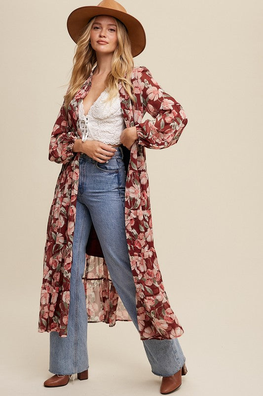 Floral flowy long sleeve button-down maxi dress by Listicle featuring a lightweight fabric and vibrant floral pattern.