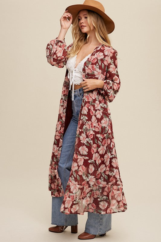 Floral flowy long sleeve button-down maxi dress by Listicle, featuring a vibrant floral pattern and a relaxed, elegant silhouette.