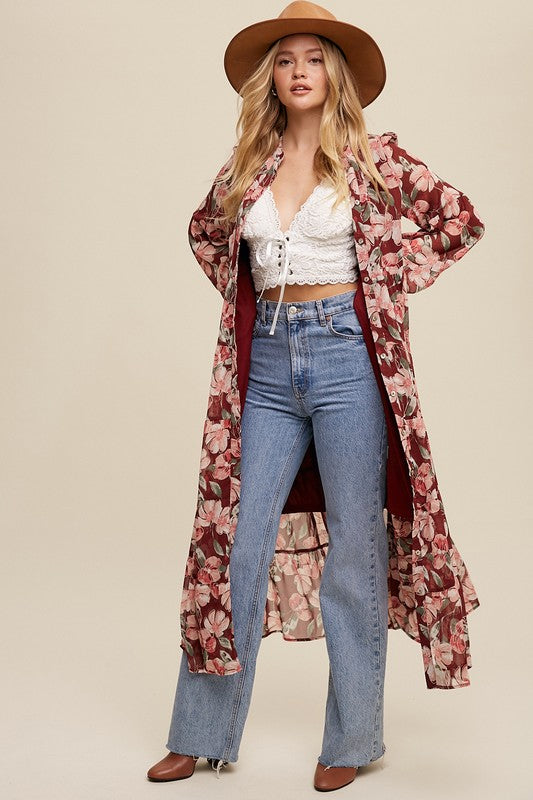 Floral flowy long sleeve button-down maxi dress by Listicle, featuring a vibrant floral pattern and lightweight fabric.